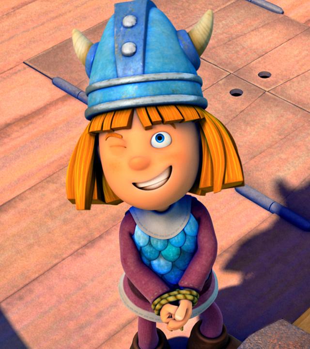 Wickie steht mit gefesselten Händen auf dem Schiff und trickst damit alle aus.