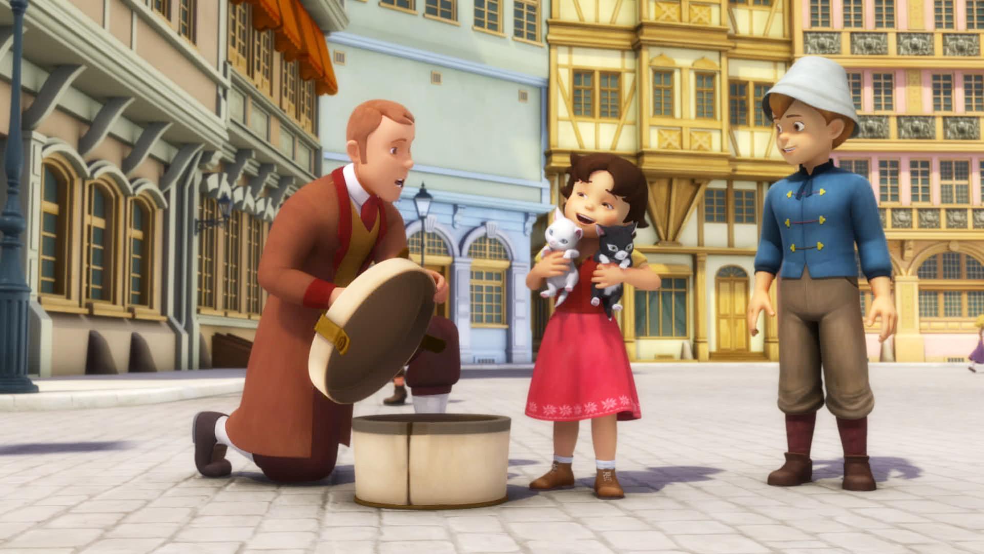 Heidi hält zwei Kätzchen im Arm. Auf ihrem rechten Arm eine weiße Katze und auf ihrem linken Arm ein schwarzes Kätzchen.