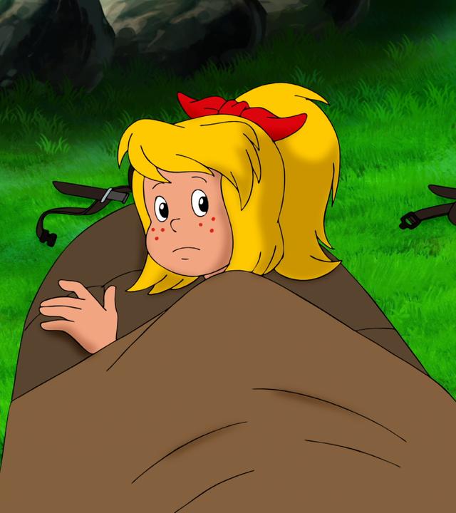 Bibi und Tina liegen in ihren Schlafsäcken.