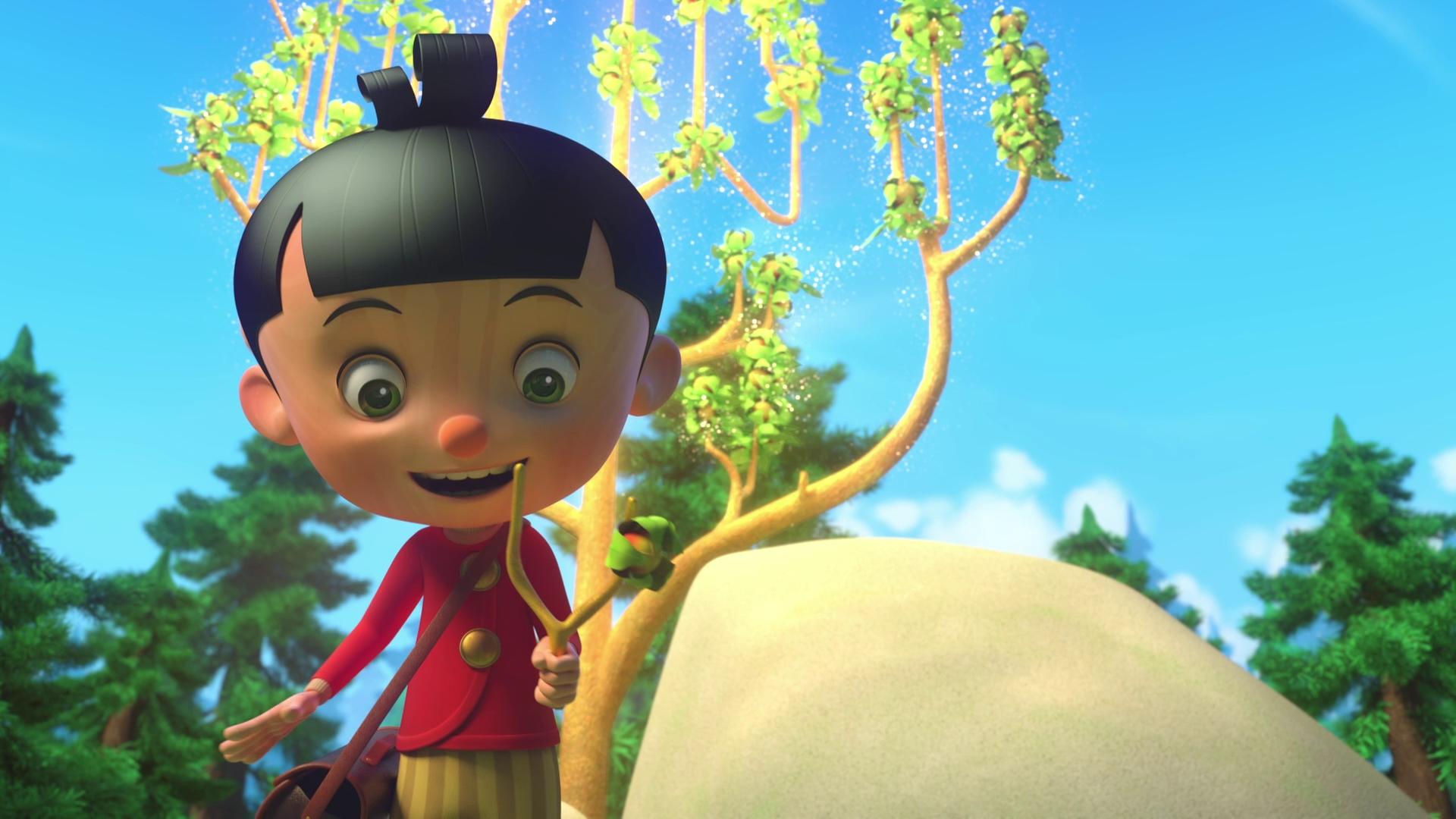 Pinocchio freut sich über einen Zweig, der sich perfekt für eine Steinschleuder eignet. Er hält den Zweig in der Hand und schaut ihn begeistert an. Hinter ihm sind ein großer Felsen und ein wunderschöner, glitzernder Baum zu sehen.