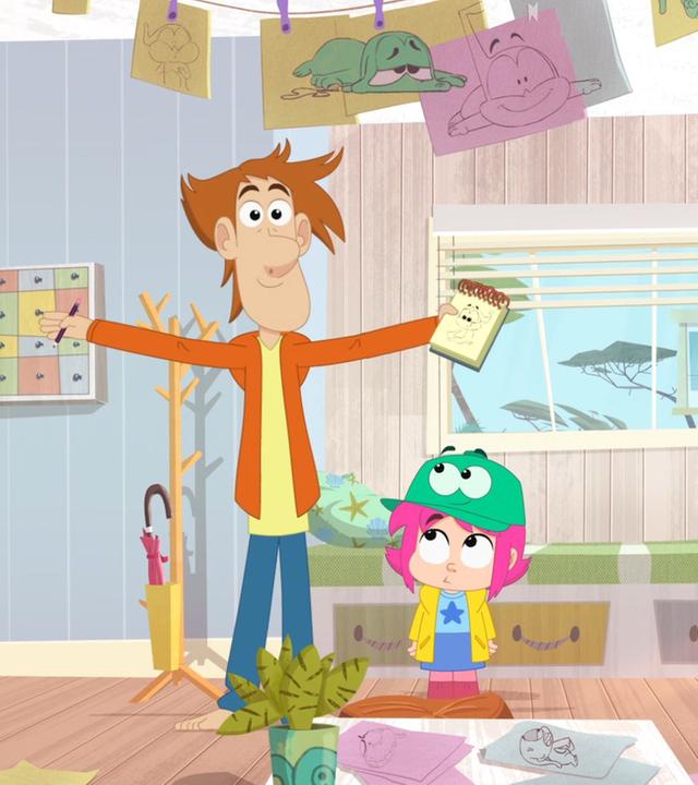 Rebeccas Papa steht mit begeisterter Miene und einem Zeichenblock inh der Hand im Wohnzimmer. Rebecca und Ernest stehen neben ihm. Ernest ist als Rebeccas Hut verkleidet und überall liegen Zeichnungen von ihm.