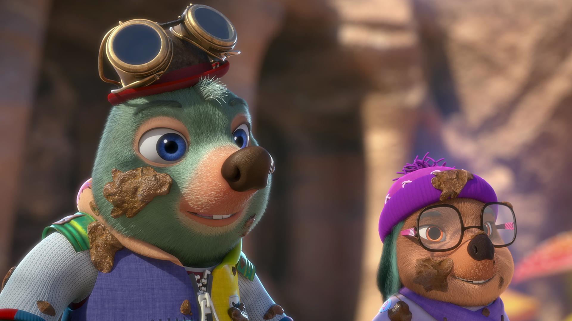 Moley steht neben Dotty. Beide sehen gut gelaunt aus und haben Schlammspritzer überall verteilt auf Gesicht und Kleidung.