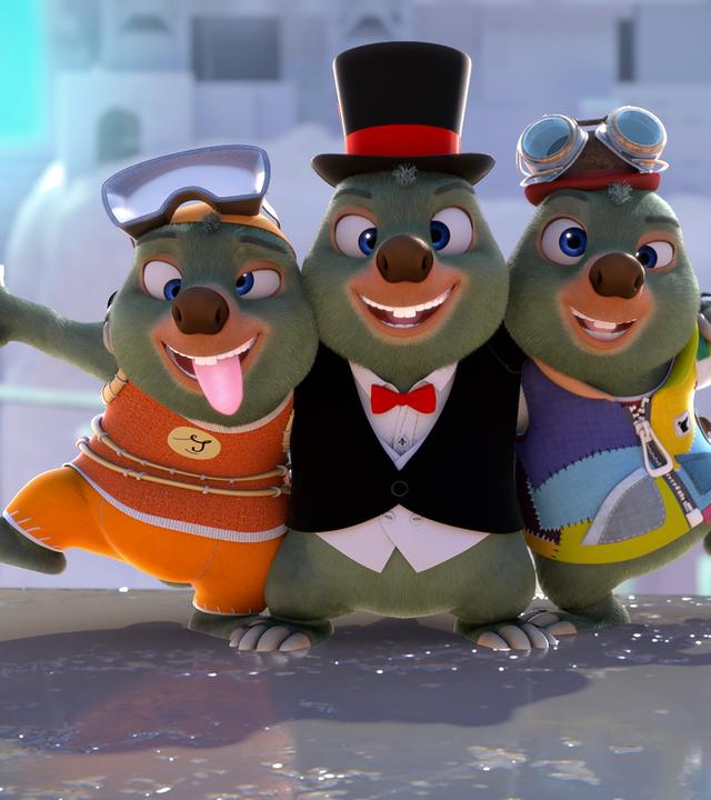Drei Moleys in unterschiedlicher Kleidung stehen in freundschaftlicher Umarmung nebeneinander. Der Moley in der Mitte trägt einen schwarzem Zylinder, der links hat eine Taucherbrille auf dem Kopf, der rechts eine Spaßbrille. Alle drei haben einen schielenden Blick.