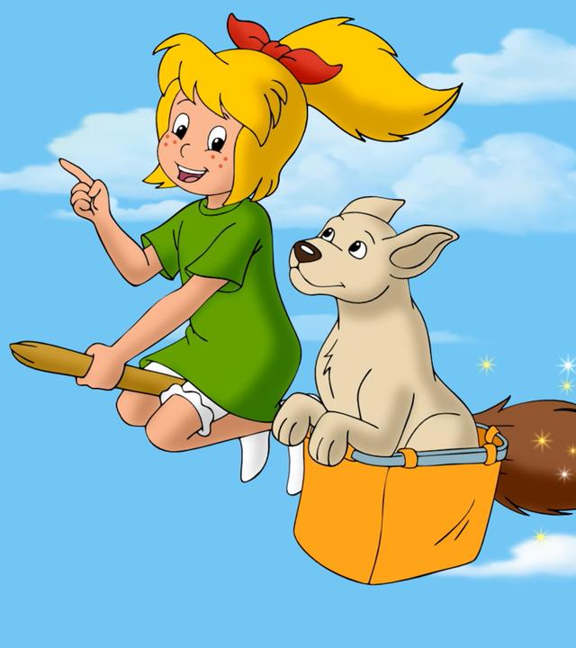 Bibi fliegt auf ihrem Besen durch die Luft. An der Seite des Besens hängt eine Kiste, in der eine Hündin sitzt. Ihre Ohren wehen im Wind.