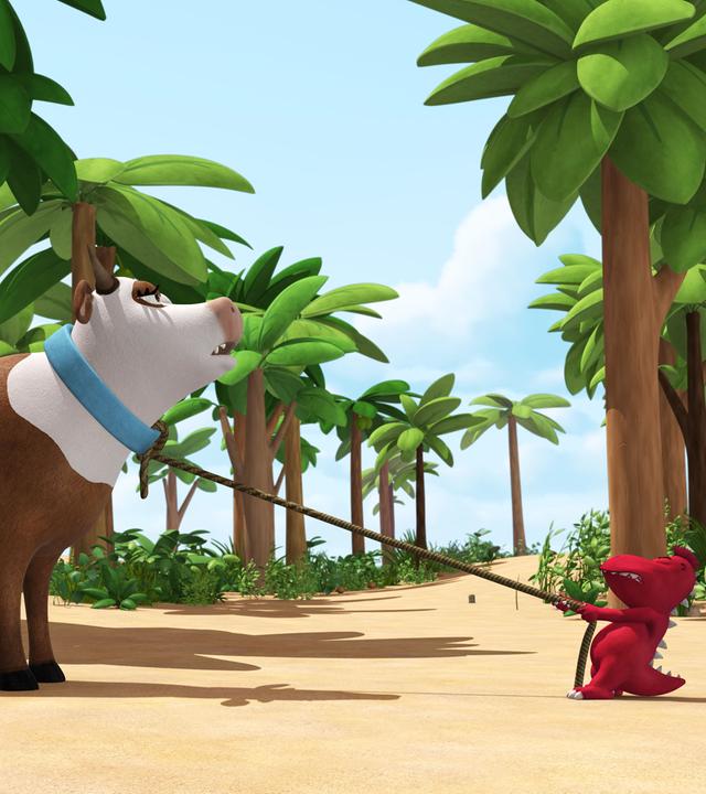 Oskar zieht kräftig an der Leine einer Kuh. Doch diese rührt sich kein Stück.