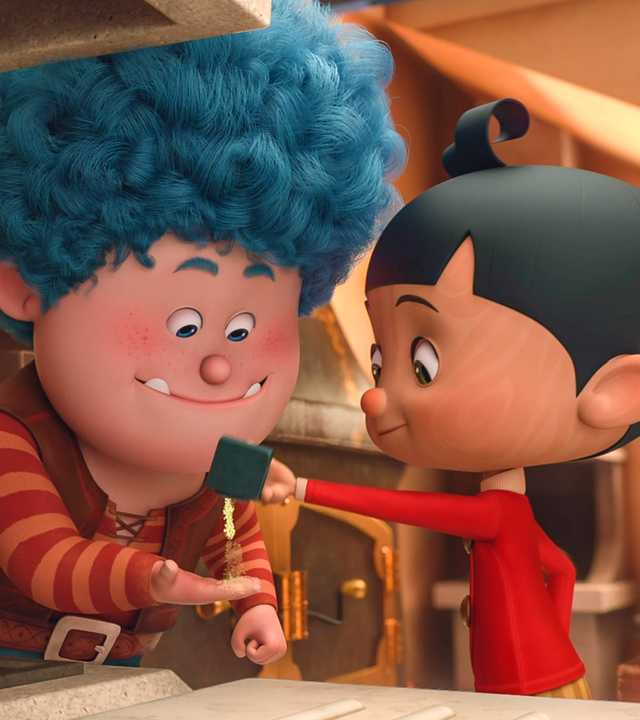 Luzio und Pinocchio bereiten in der Küche etwas zu. Links neben ihnen steht ein Kessel.