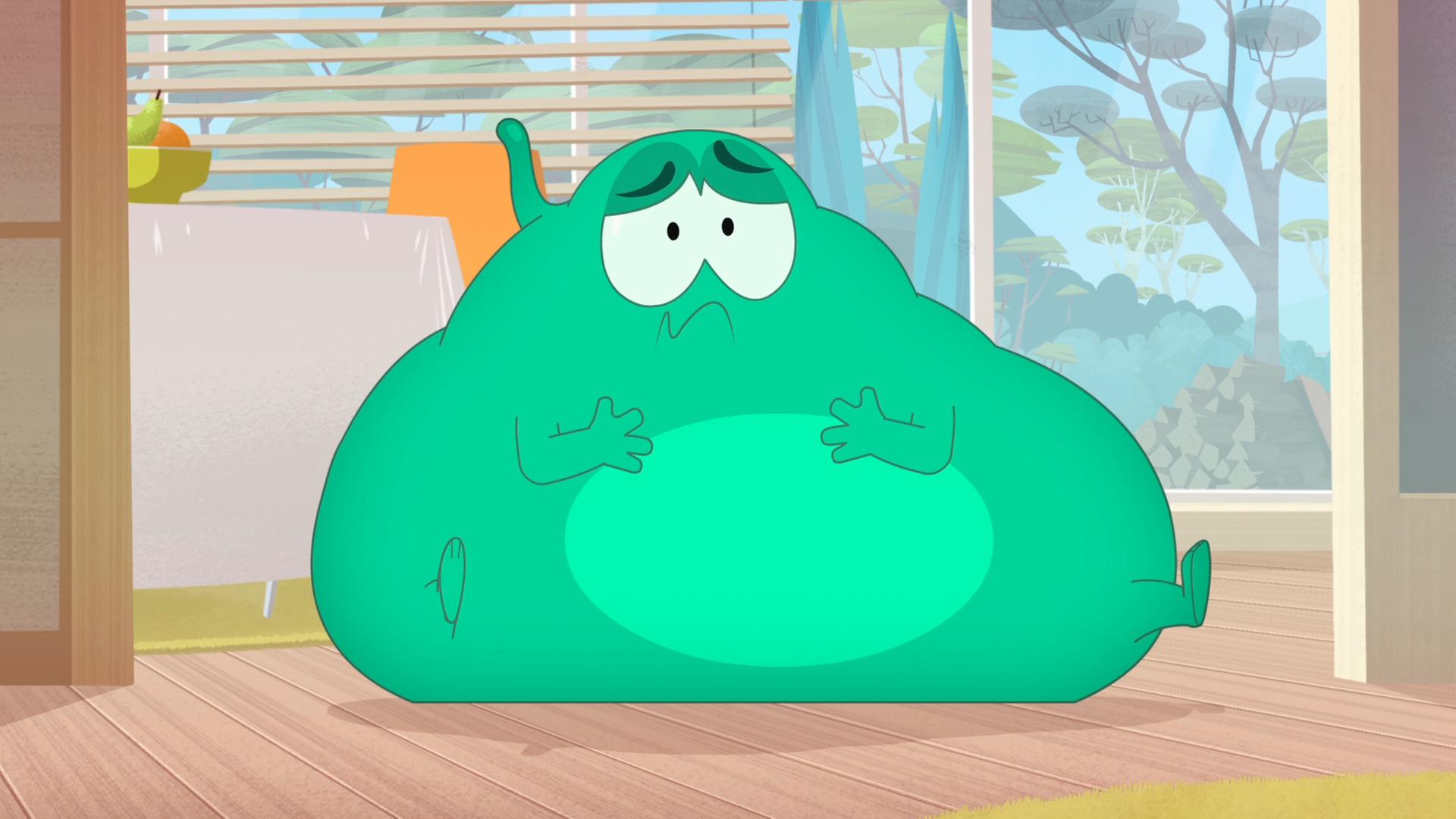 Ernest sitzt kugelrund auf dem Boden und schaut bedrückt drein.