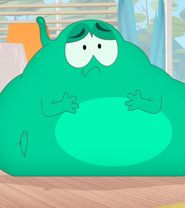 Ernest sitzt kugelrund auf dem Boden und schaut bedrückt drein.