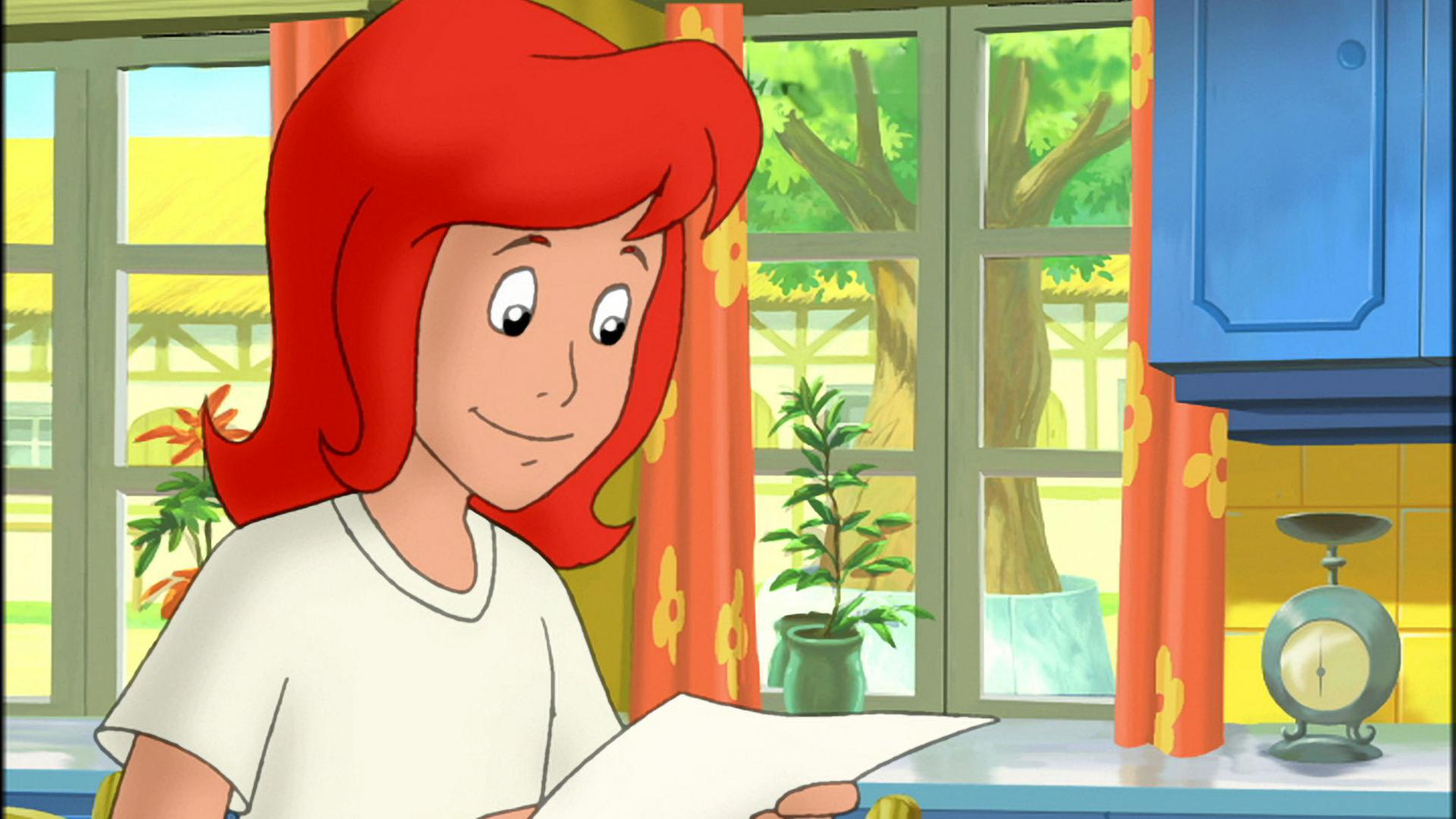 Tina steht in der Küche und hält einen Brief in der Hand. Sie wirkt sehr glücklich.