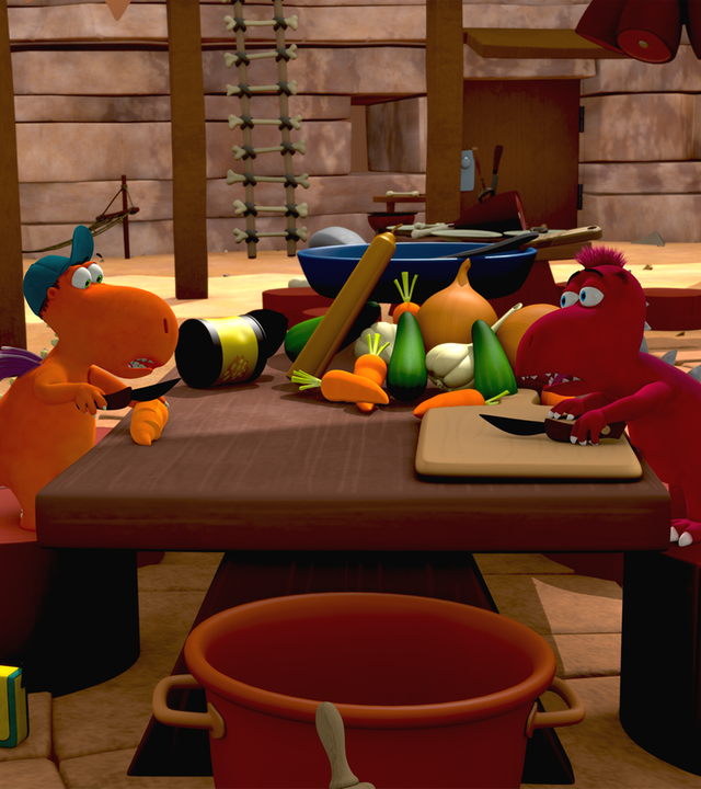 Kokosnuss, Matilda und Oskar bereiten das Essen vor. Sie stehen um einen Tisch herum, auf dem ganz viel Gemüse liegt.