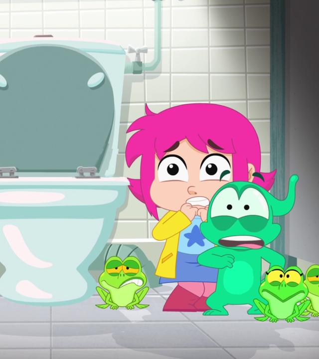 Rebecca und Ernest stehen zusammen mit vier Fröschen neben einer Toilette. Sie schauen alle entsetzt.