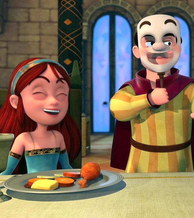 Marian und Robin sitzen am gedeckten Tisch. Zwischen ihnen steht der Possenreißer, der eine Maske trägt und die beiden zum Lachen bringt.