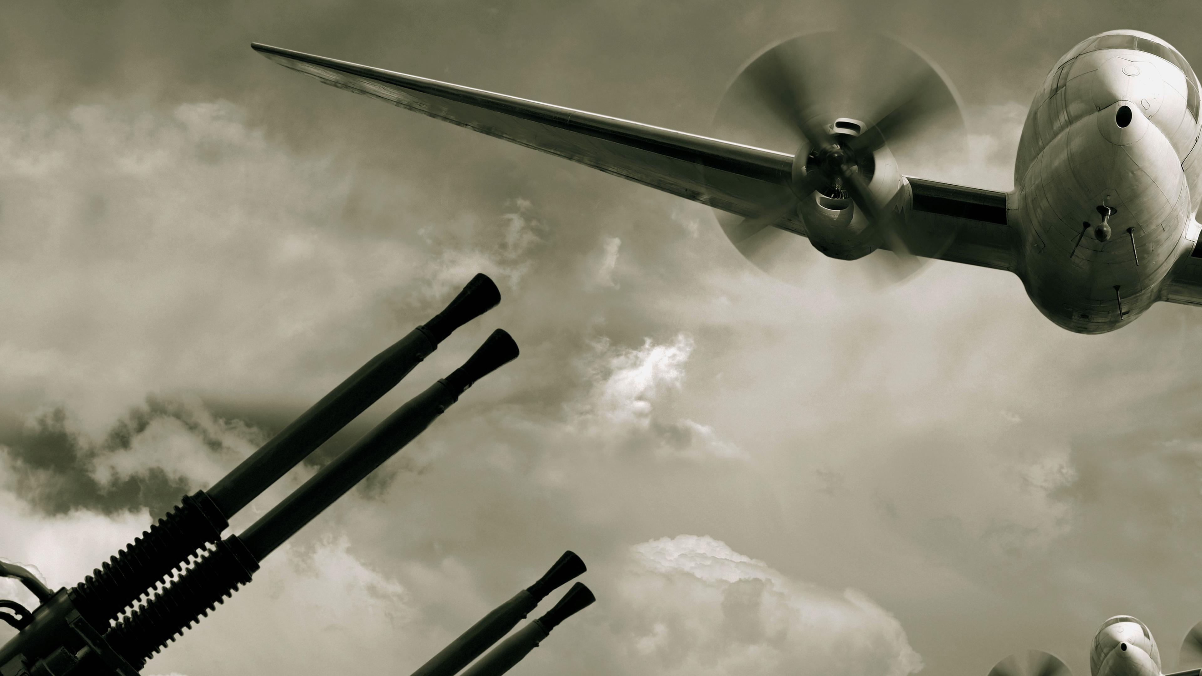 "Der Preis des Krieges - Zweiter Weltkrieg": Schwarz-Weiß-Bild-Collage: Zwei Militärflugzeuge überfliegen Flugabwehrgeschütze.