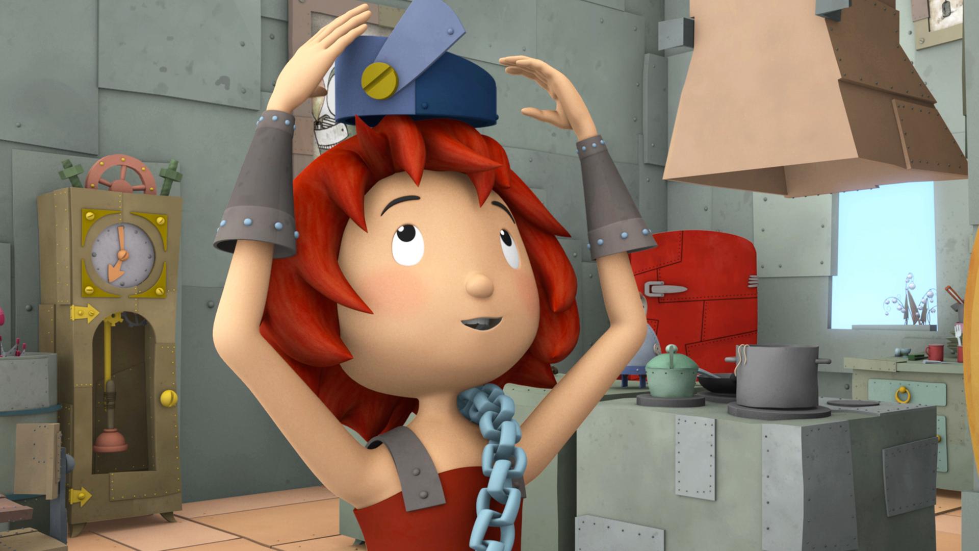 Bö trägt auf ihrem Kopf eine kuriose Kopfbedeckung, nach der sie mit ihren Händen tastet.