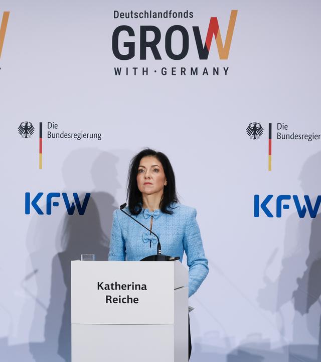 Stefan Wintels (R) gestures as he speaks next to German Economy Minister Katherina Reiche (C) and German Finance Minister Lars Klingbeil (L) during a press conference