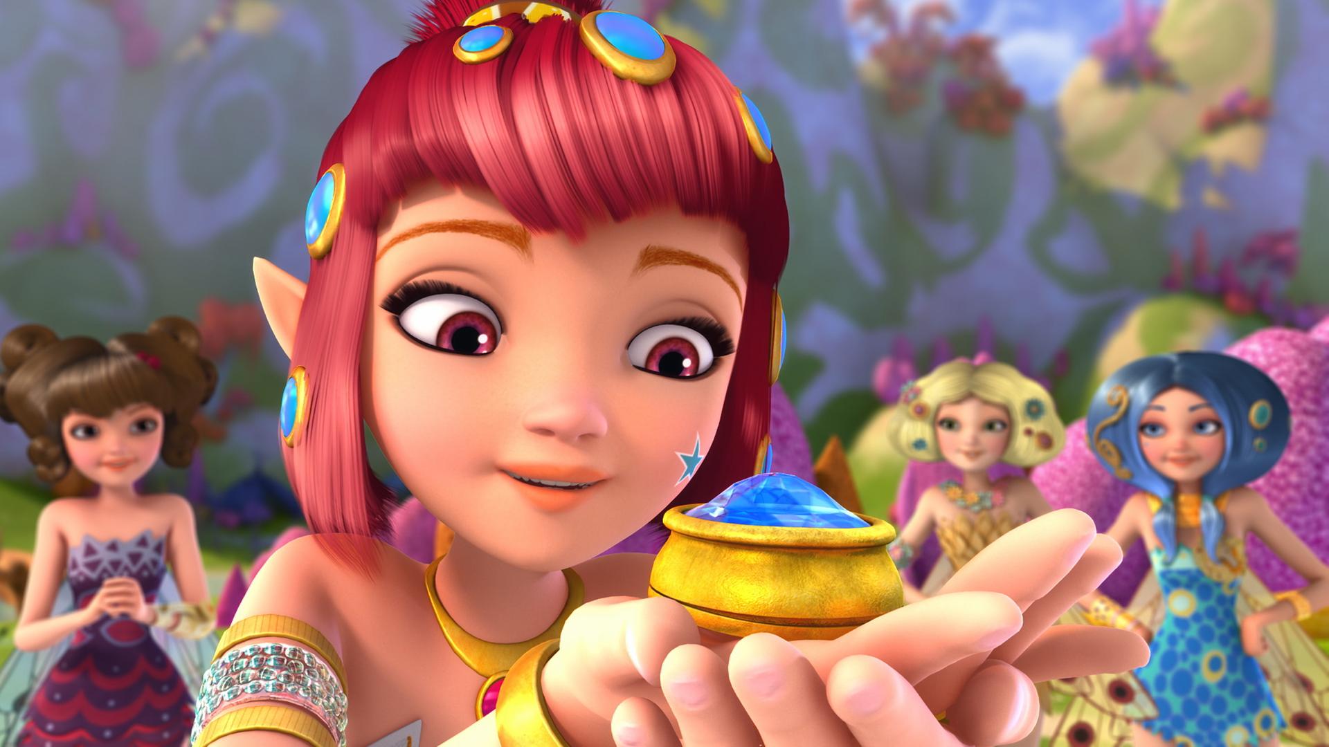 Yuko hält einen großen, blauen Diamant auf ihrer Hand und bestaunt ihn. Im Hintergrund stehen drei weitere Elfen und schauen zu.