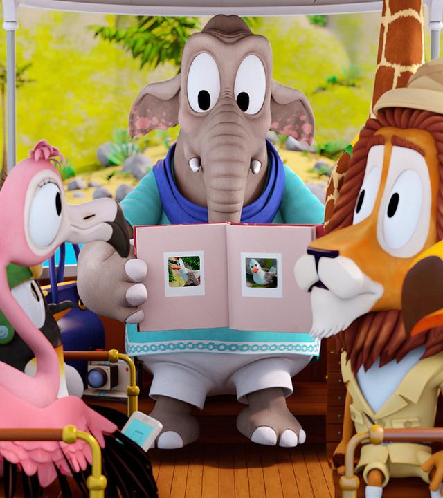 Die Elefantendame zeigt den anderen Zootieren ein Fotobuch mit Fotos von schönen Vögeln.