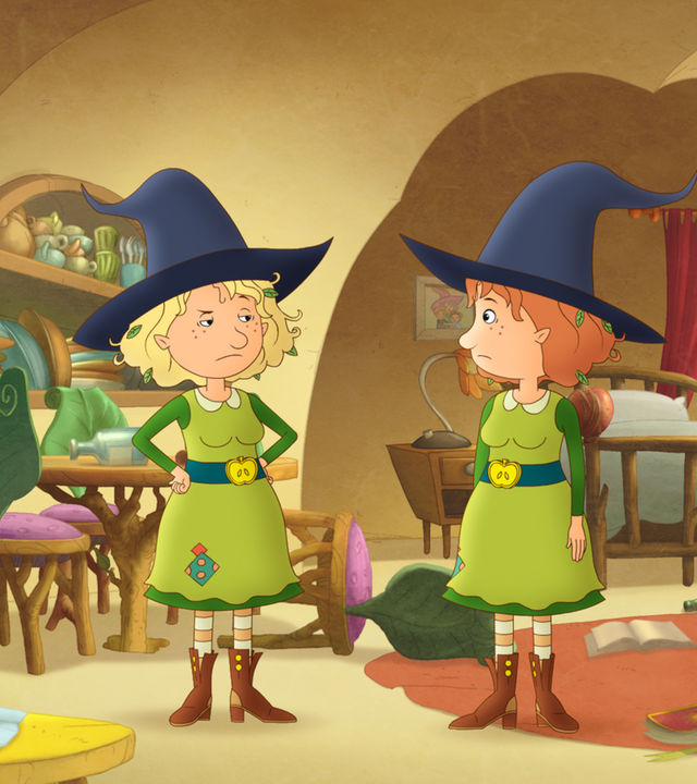 Petronella steht ihrer Doppelgängerin verblüfft gegenüber. Die Doppelgängerin sieht sehr schlecht gelaunt aus.