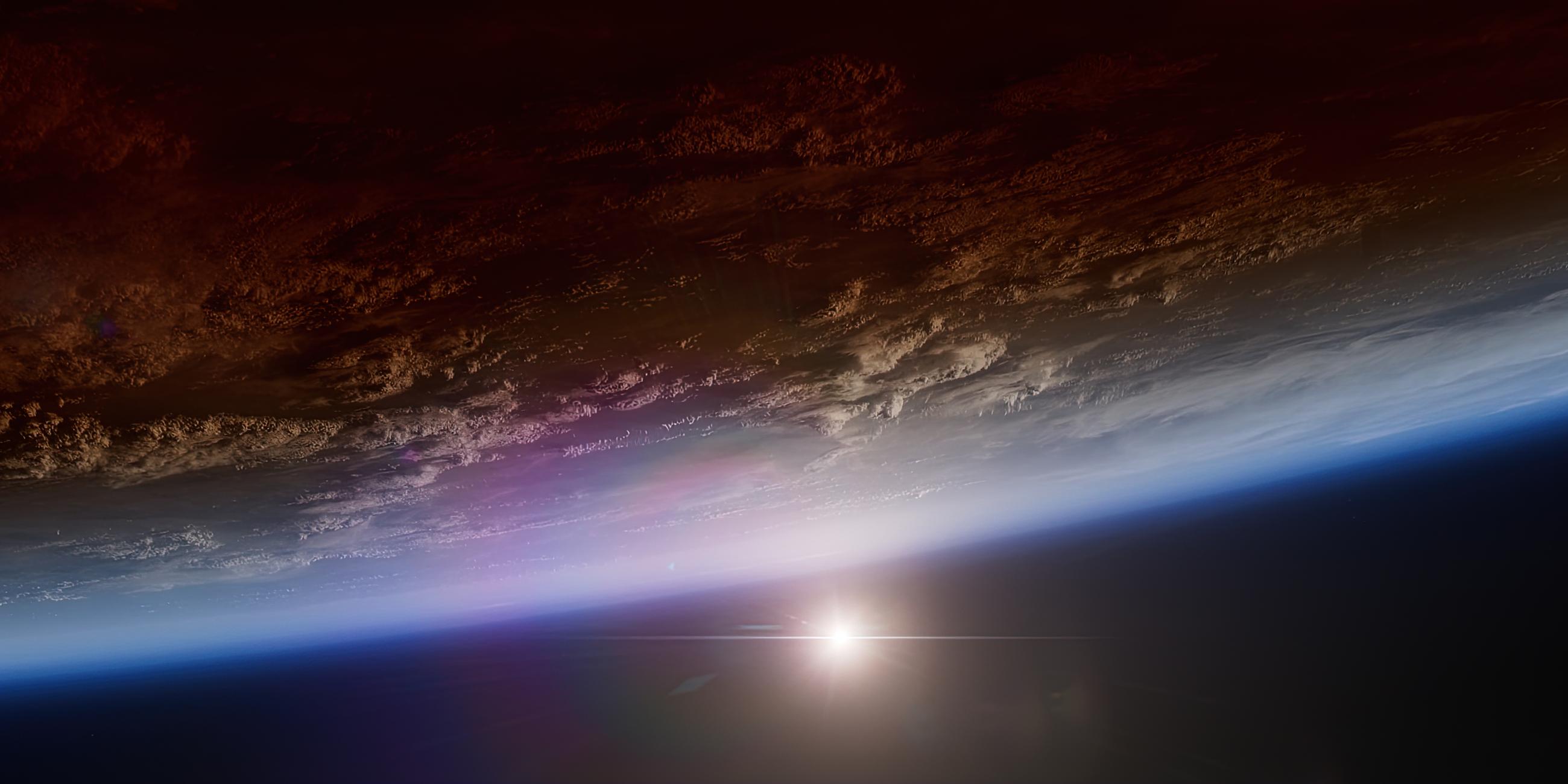 Animiertes Bild der Erdoberfläche aus dem All gesehen, eine dünne blaue Schicht umgibt den Planeten, im Hintergrund die Sonne.