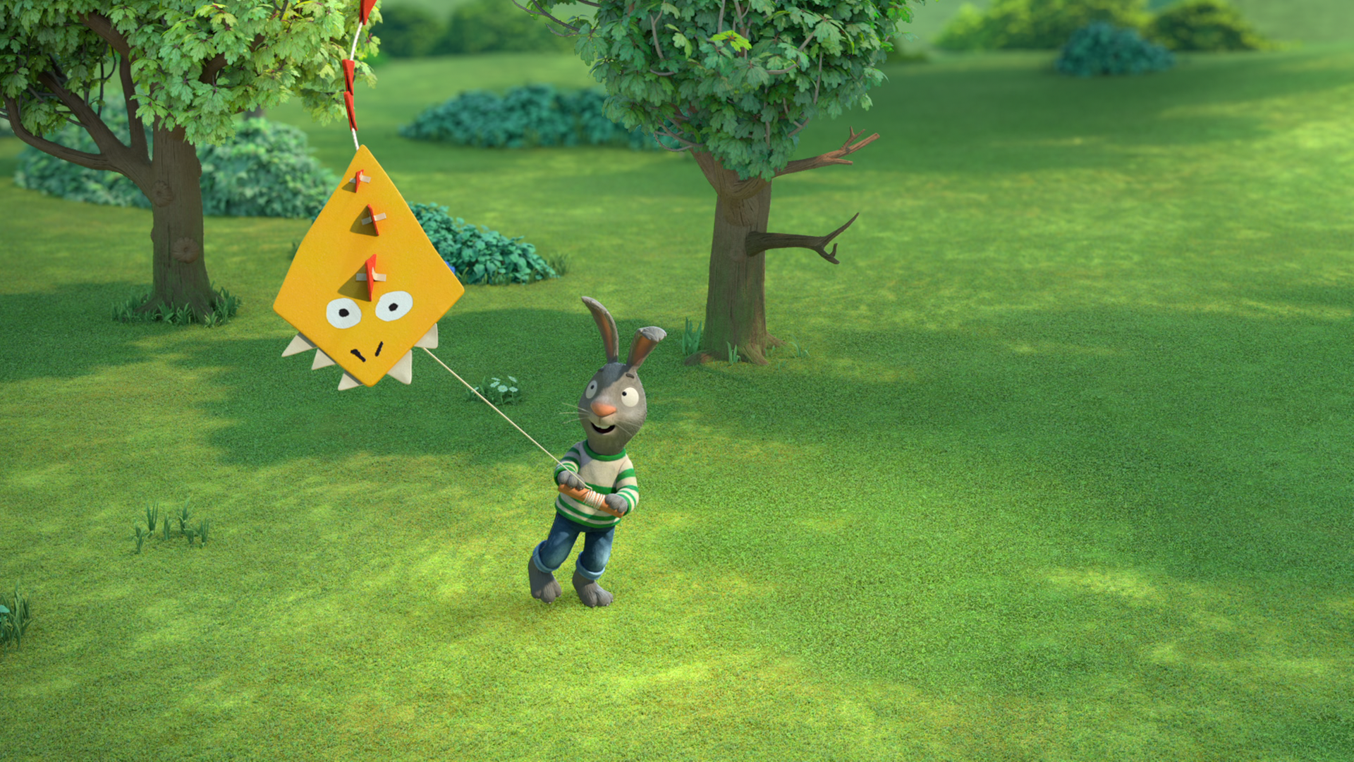 Pip lässt einen gelben Drachen steigen. Er ist im Park und hält ihn an einer Schnur.