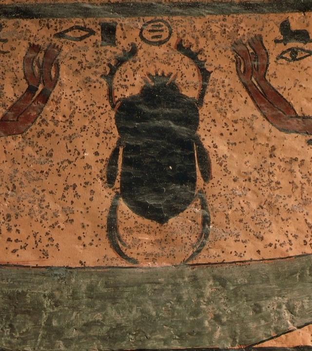 Eine ägyptische Wandmalerei zeigt zwei Personen, die mit erhobenen Armen einen mächtigen "Pillendreher" anbeten.