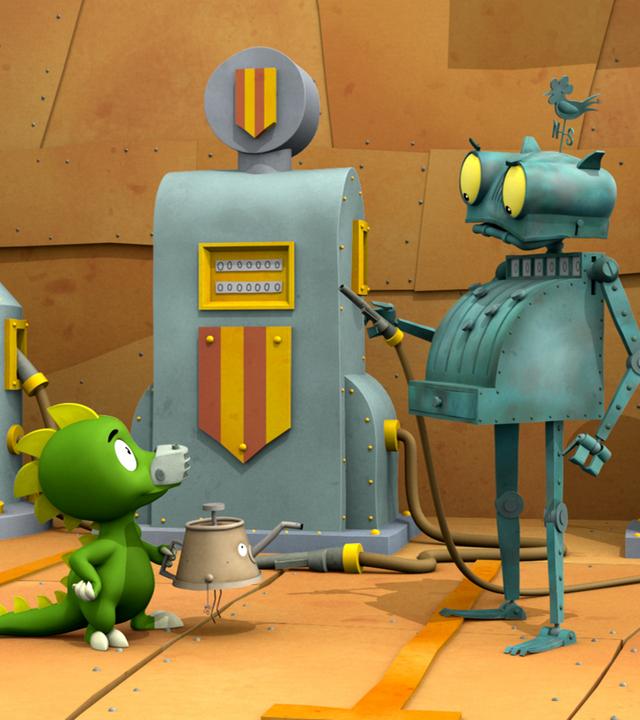 Ritter Rost vor einer Zapfsäule mit einem Zapfventil in der Hand, Drache Koks hält ein Ölkännchen.