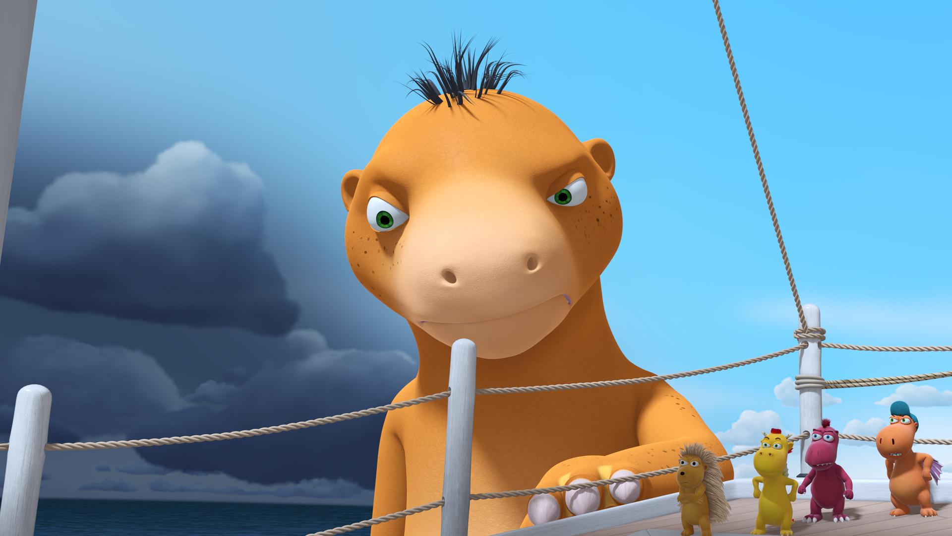 Der Wasserdrache Amadeus steht neben Chef's Schiff im Wasser. Er sieht unzufrieden aus. Auf dem Schiff stehen Matilda, Xiexie, Oskar und Kokosnuss.