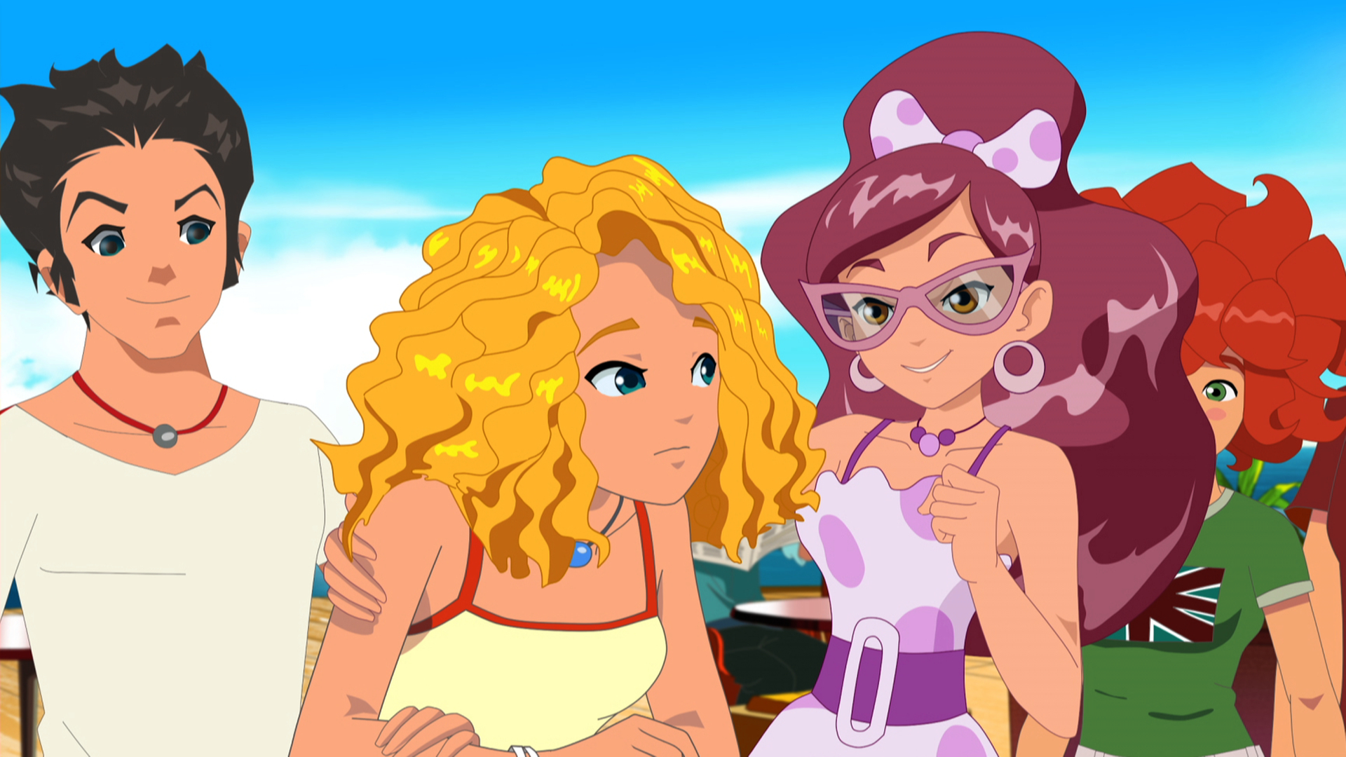 Miriam legt den Arm um Emma. Einige Freunde stehen um sie herum.