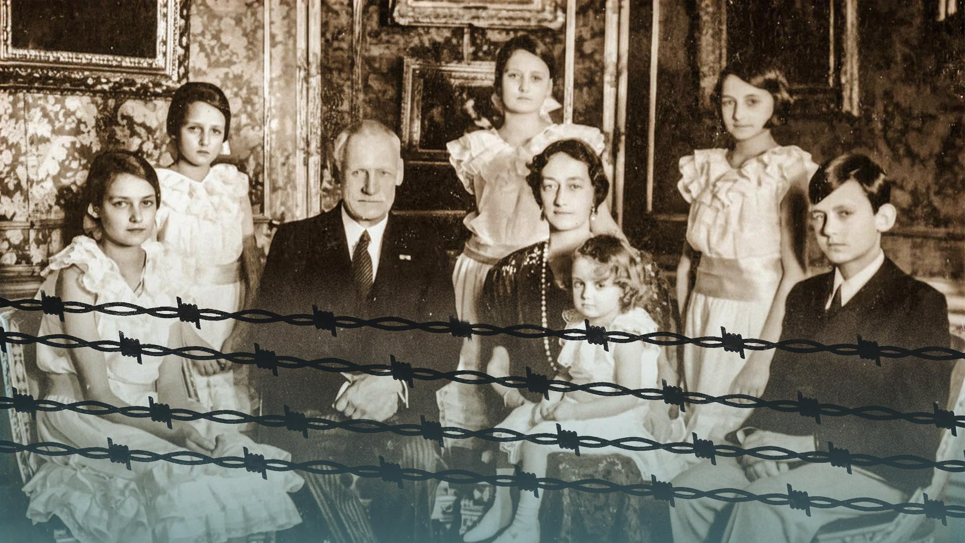 Eine Familie auf einem alten Foto. Darauf die Umrisse von Stacheldraht