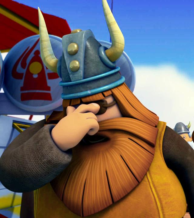 Im Vordergrund hält sich Halvar mit der rechten Hand die Augen zu. Rechts hinter ihm stehen die Wikinger und sehen ihn teils traurig, teils bestürzt an.