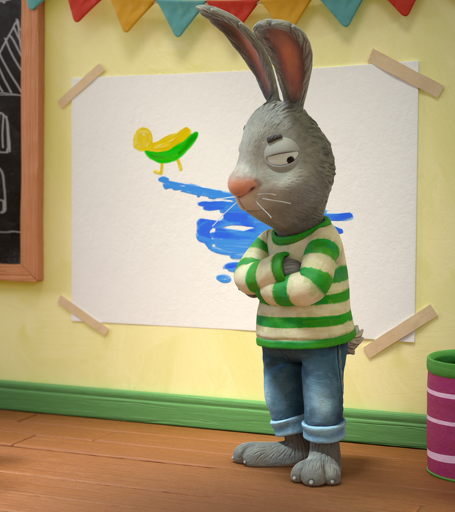 Posy (links) steht, mit einem Pinsel in der Hand, vor Pip (rechts) und spricht zu ihm. Pip steht vor dem Entebild mit blauer Farbe und verschränkt wütend seine Arme. Links im Hintergrund steht ein Tisch mit Pinseln und Wasserbechern.