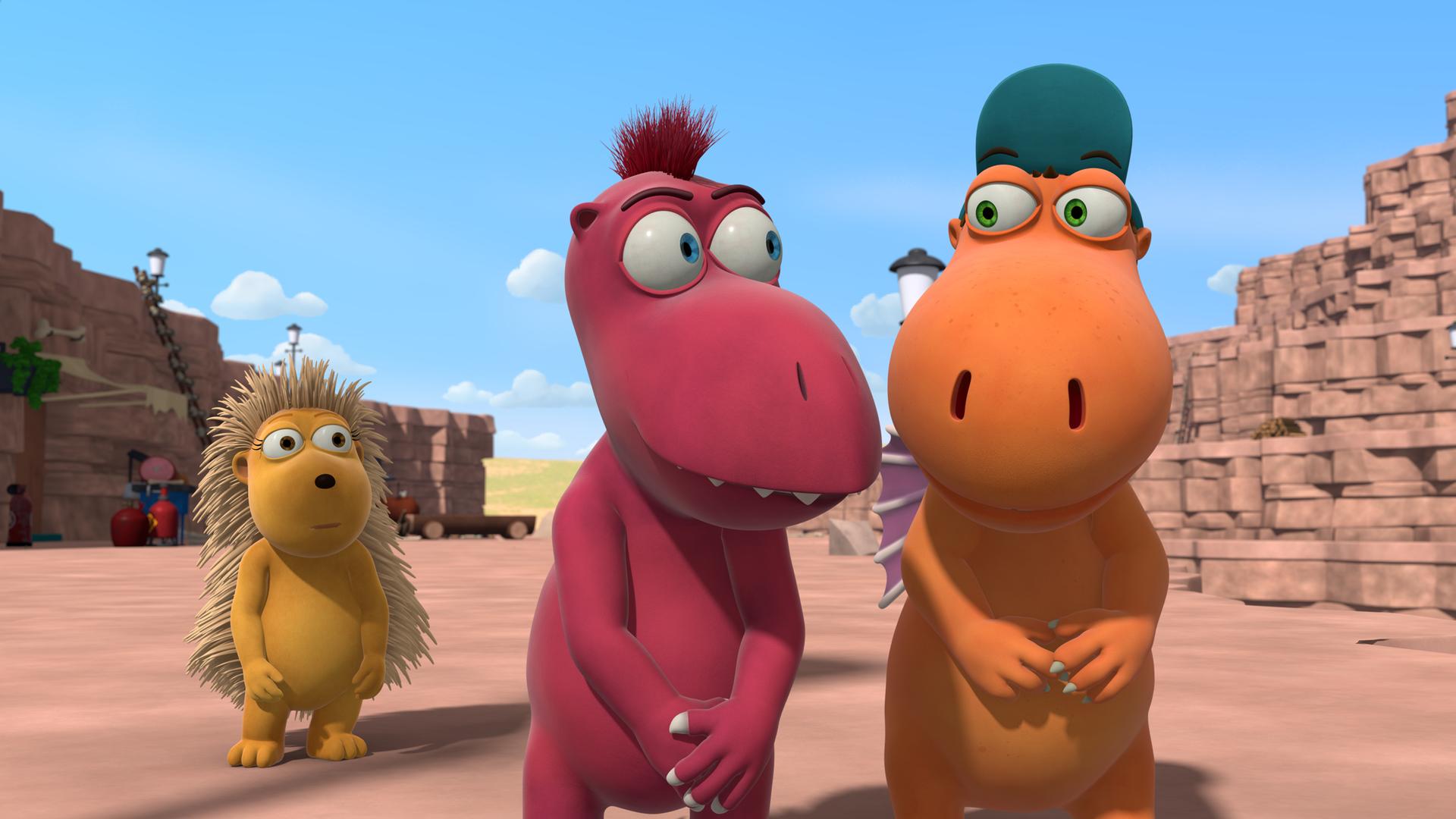 Kokosnuss und Oskar stehen nebeneinander und lächeln sich an. Im Hintergrund steht Matilda und guckt sie an.