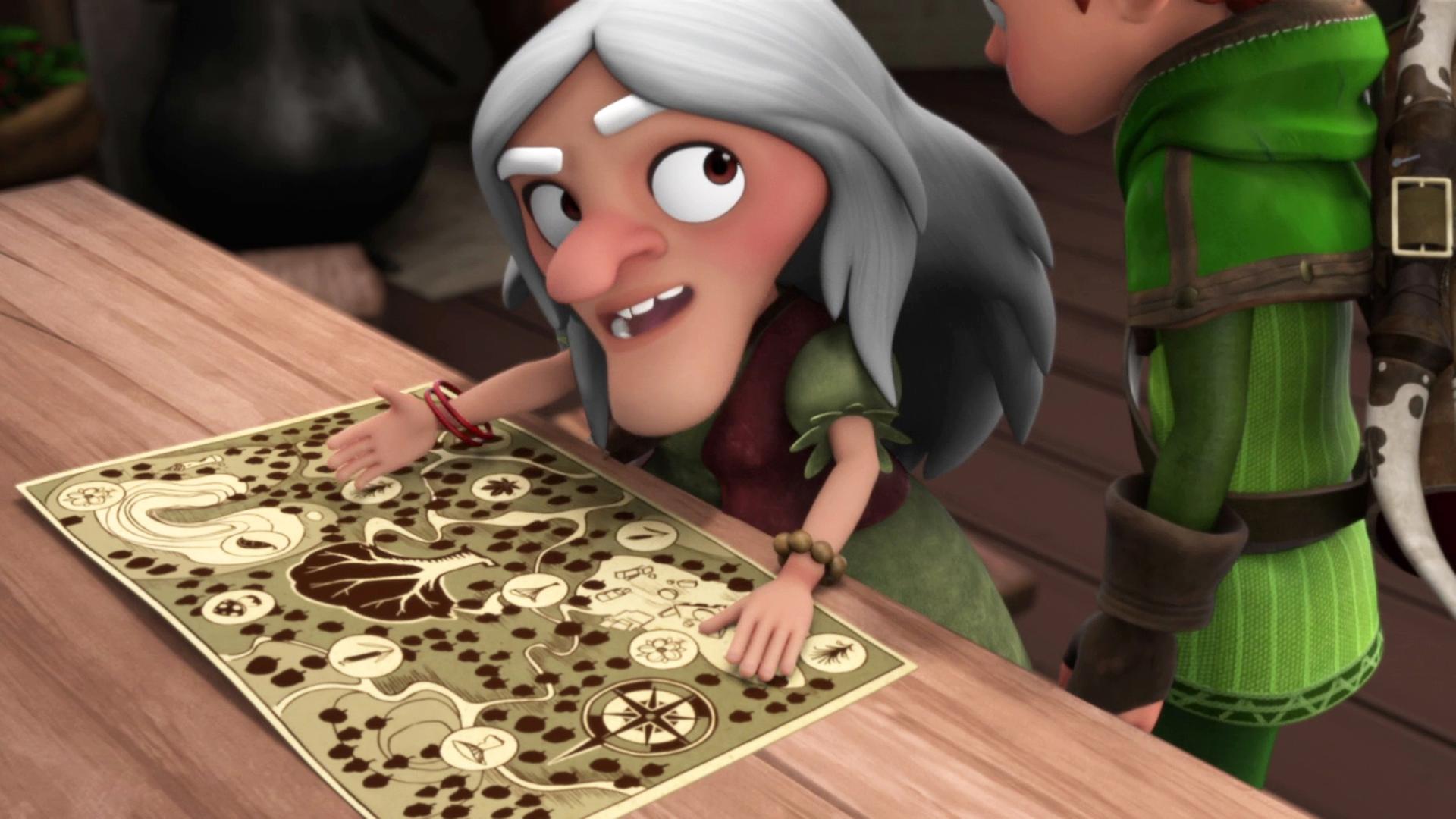 Die Kräuterfrau (links) breitet auf einem Tisch eine Karte von Sherwood aus. Robin (rechts) steht neben ihr und schaut sich die Karte an.