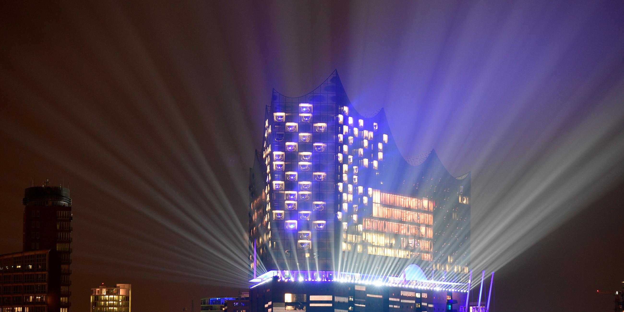 the new philharmonic hall elbphilharmonie is illuminated during its opening ceremony in hamburg
