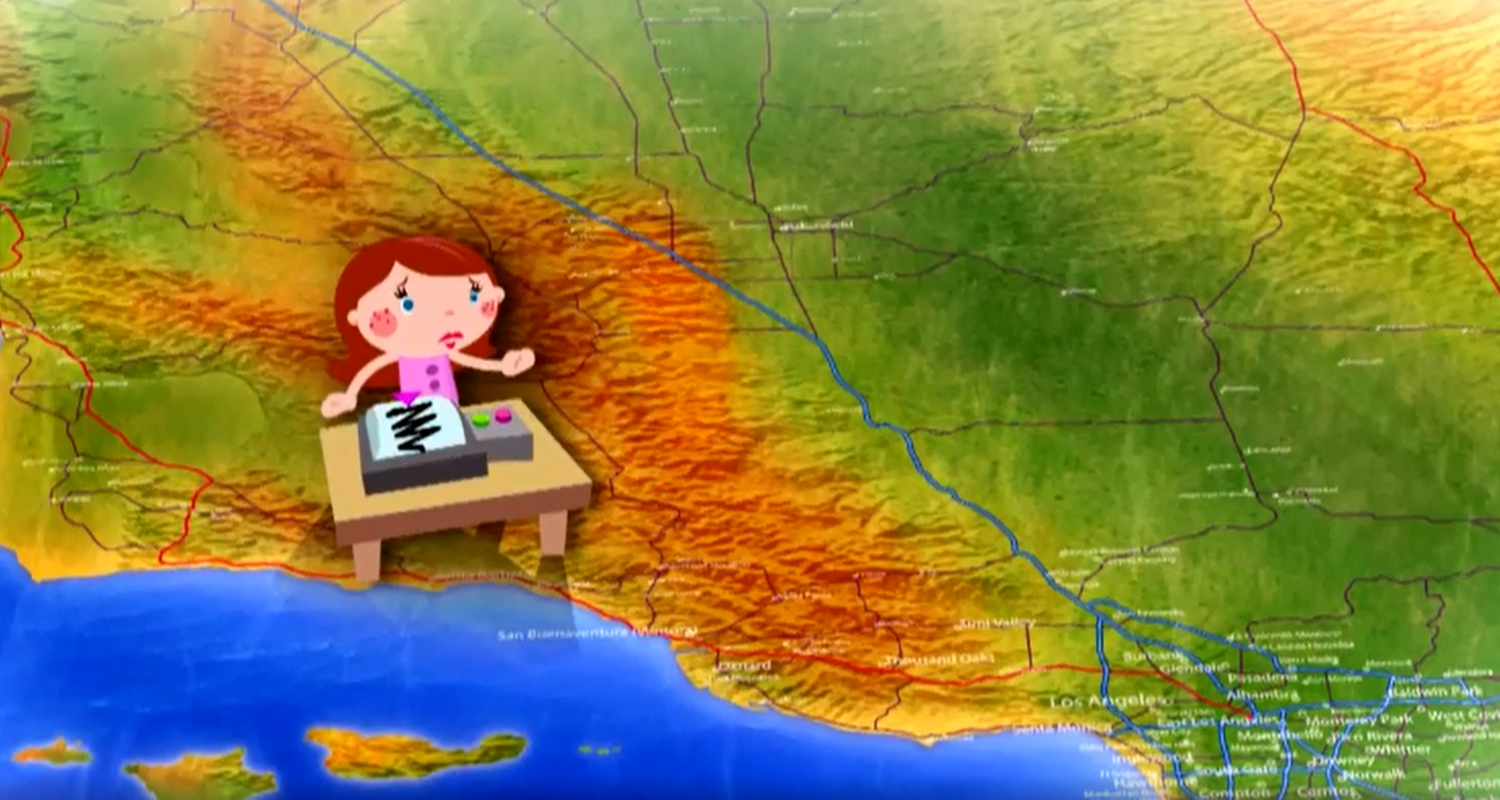 Eine Frau sitzt an einem Seismographen.