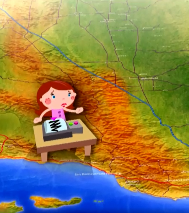 Eine Frau sitzt an einem Seismographen.