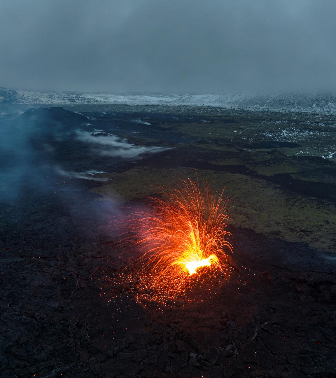 A drone picture shows lava spewing from the site of the volcanic eruption north of Grindavik, Iceland, December 20, 2023.