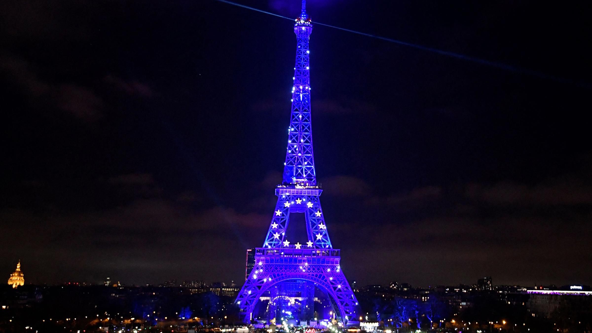 The Eiffel Tower lights up blue on New Year's Eve to celebrate France's Presidency of the Council of the European Union.