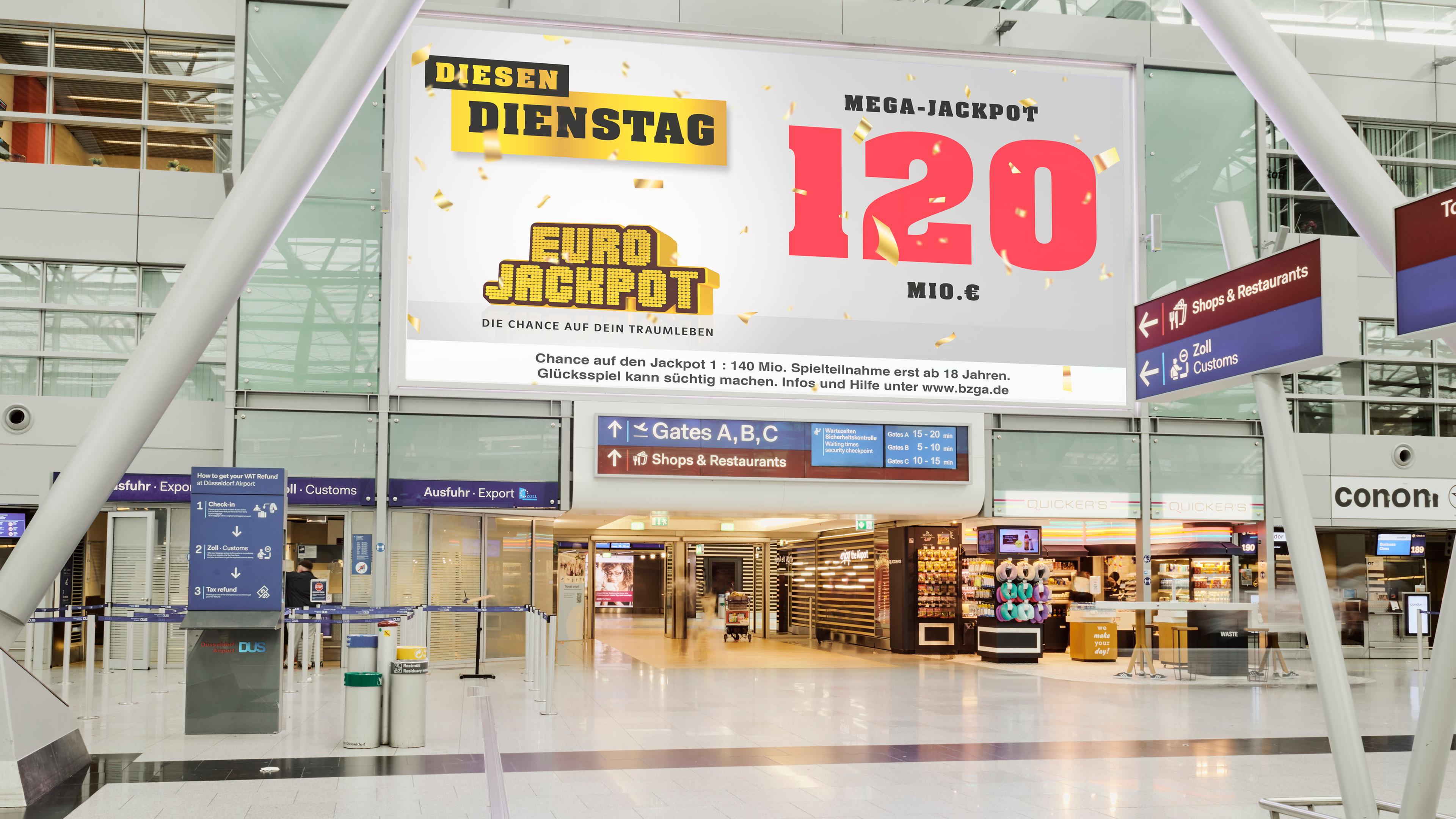 Werbung für den 120-Millionen Eurojackpot in einer Bahnhofshalle.