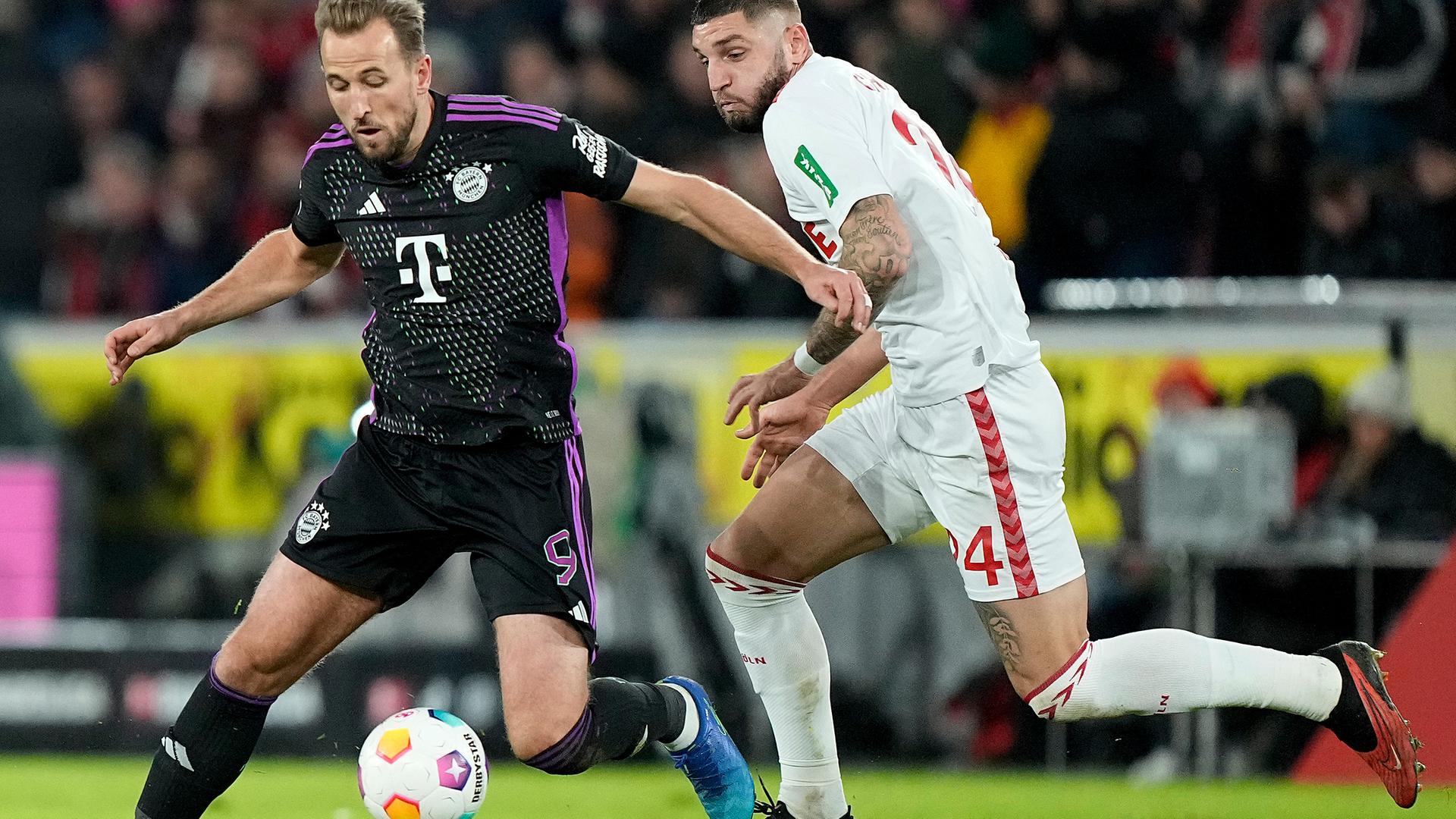 Harry Kane und Julian Chabot im Zweikampf am 24.11.23.