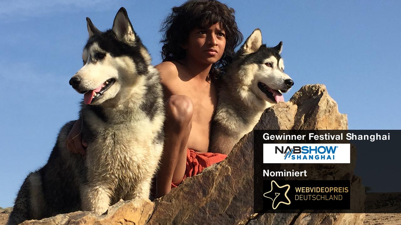 Mogli mit zwei Wölfen