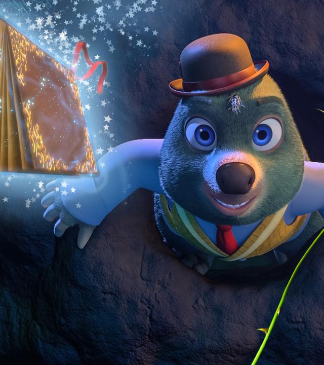 Master Moley schaut nach oben, neben ihm das magische Buch