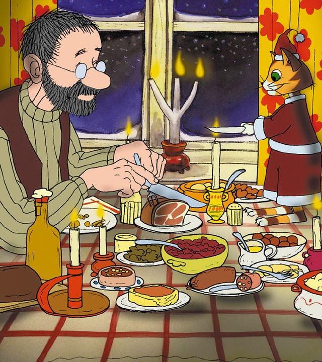 Pettersson und Findus sitzen an Weihnachten am gedeckten Tisch.