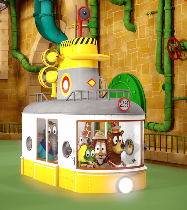 Die Zoobande sitzt in ihrem Bahnabteil und fährt durch das Wasser im Tunnelsystem. Eine helle Lampe, die vorne am Bahnabteil befestigt ist, leuchtet ihnen den Weg.