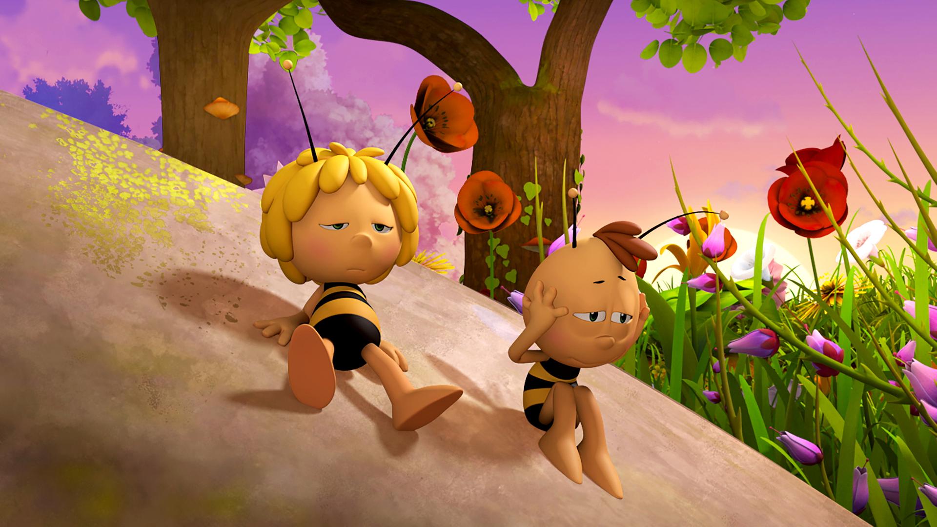 Maja und Willi wirken sehr erschöpft und ruhen sich auf einem großen Felsen aus.