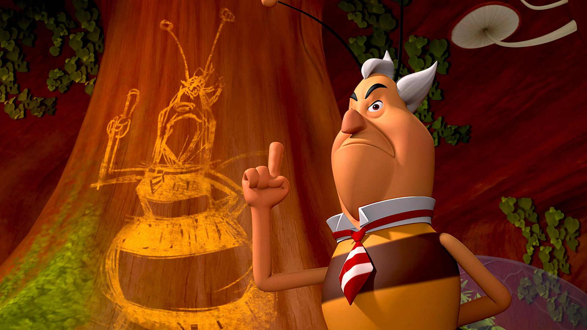 Richter Bienenwachs steht mit erhobenem Zeigefinger vor einer Schmiererei, die ihn selbst zeigt.