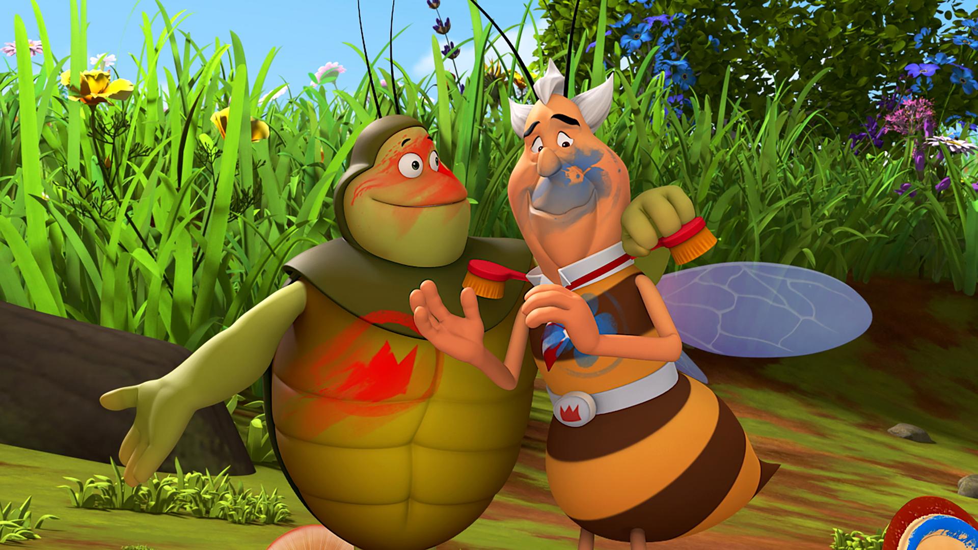 Richter Bienenwachs und Kurt stehen Arm in Arm nebeneinander und sind mit Farbe beschmiert.