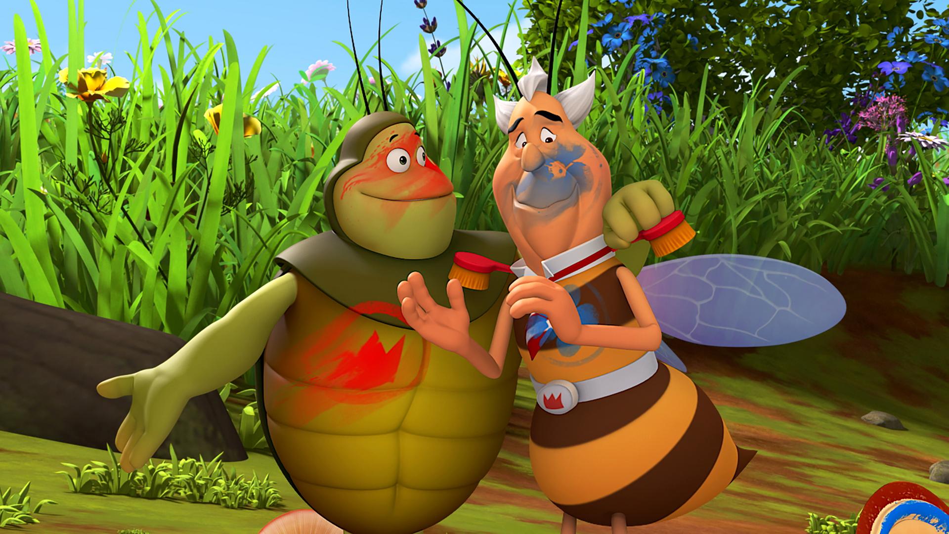 Richter Bienenwachs und Kurt stehen Arm in Arm nebeneinander und sind mit Farbe beschmiert.