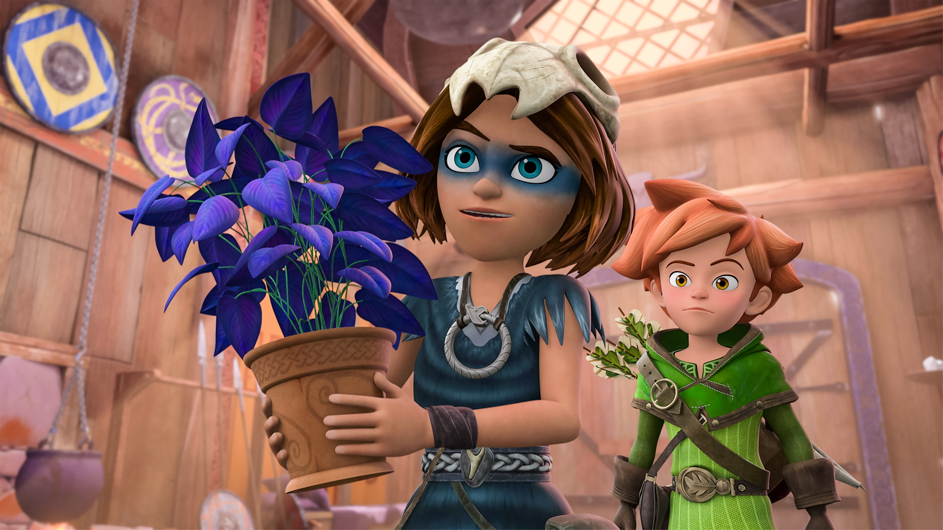 Im Wohnhaus der Wikinger hält Stig eine Pflanze in einem Tontopf in den Händen und präsentiert sie jemandem. Die Pflanze hat grüne Blumenstiele, ihre Blätter sind blau-violett. Robin steht hinter ihm und blickt skeptisch.