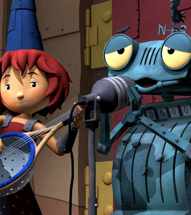 Ritter Rost und Bö stehen auf der Bühne und spielen ihr Lied. Rösti singt herzergreifend.